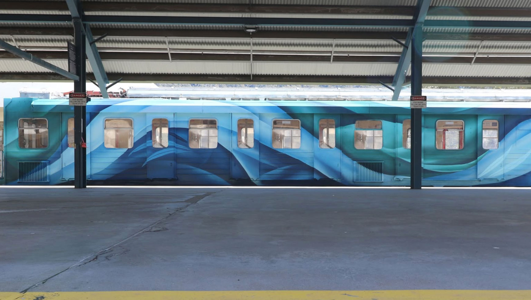 Perisher Ski Tube Mural Perisher Ski Tube with blue abstract artwork along the carriage.