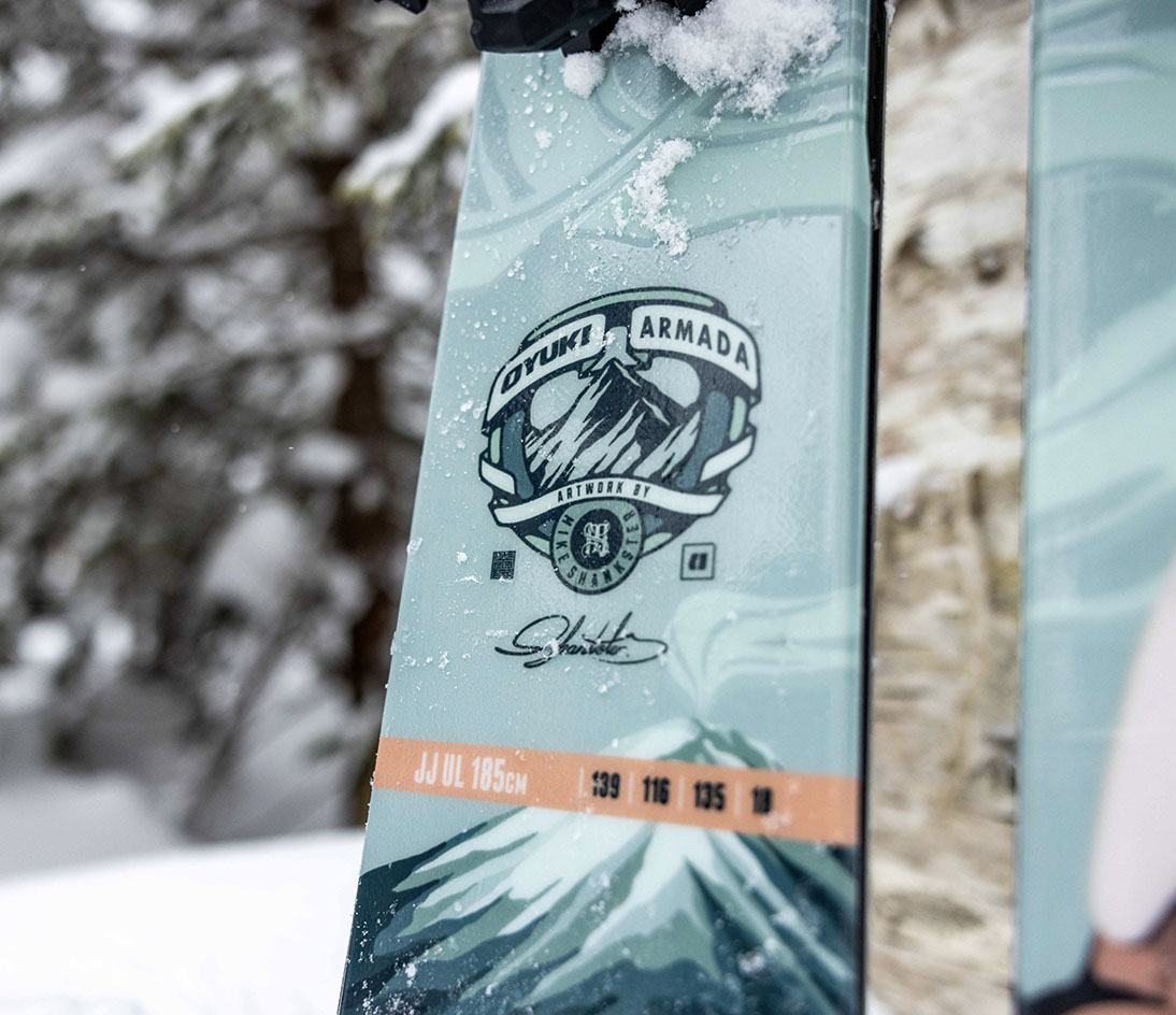 OYUKI x Armada collaboration logo and signature detailing. Close-up of the OYUKI x Armada logo and Mike Shankster signature on the ARV JJ-UL ski.