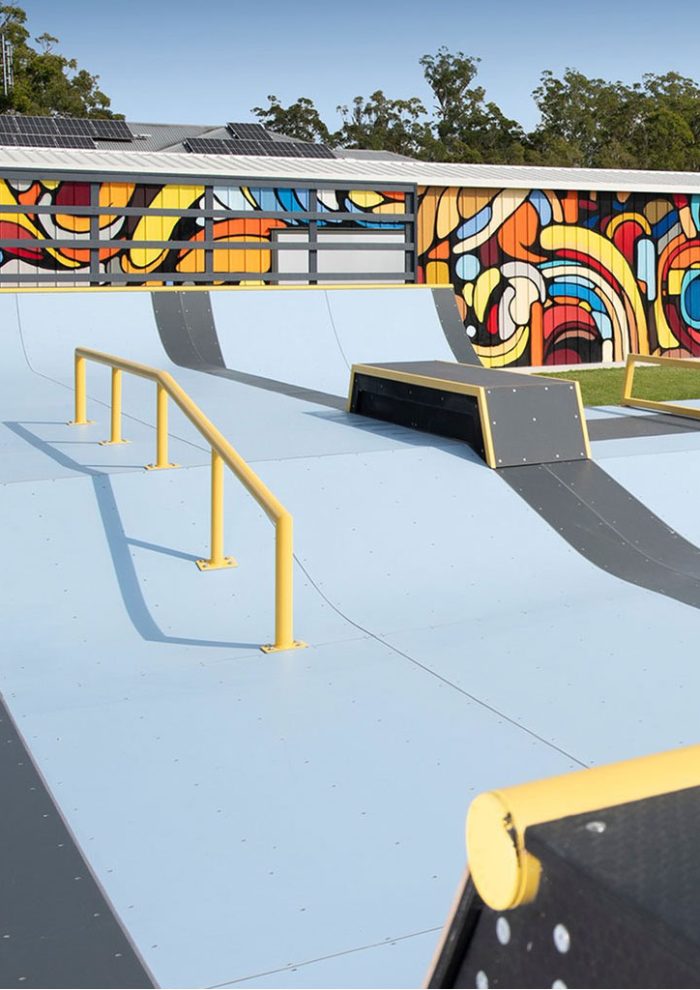 Backyard skate ramp with colourful shed mural painted in Glass House Mountains by Mike Shankster