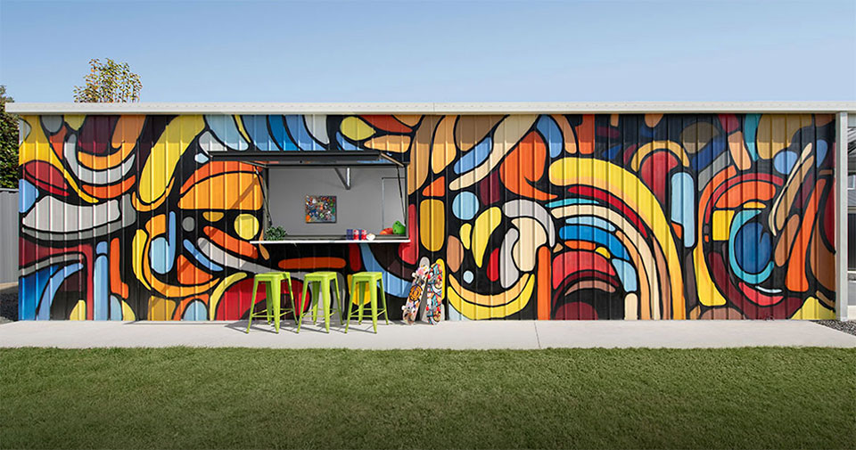 Close view of a backyard skate ramp with a colourful shed mural in Glass House Mountains