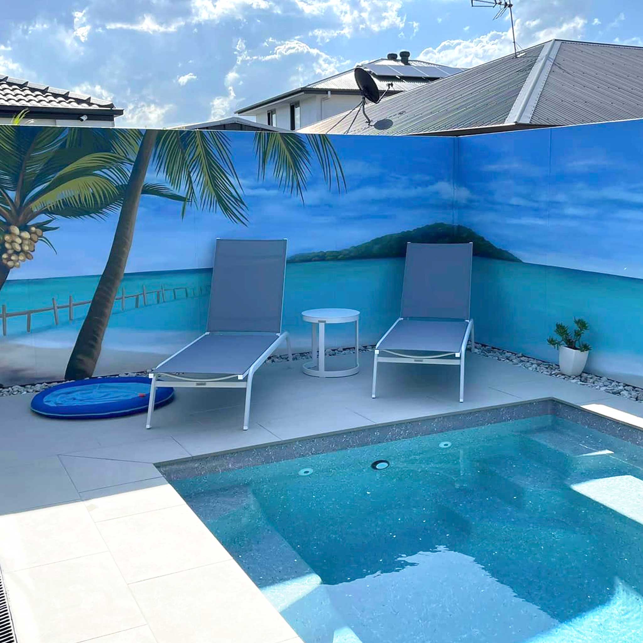 Gold Coast pool mural with beach scene painted on a backyard fence