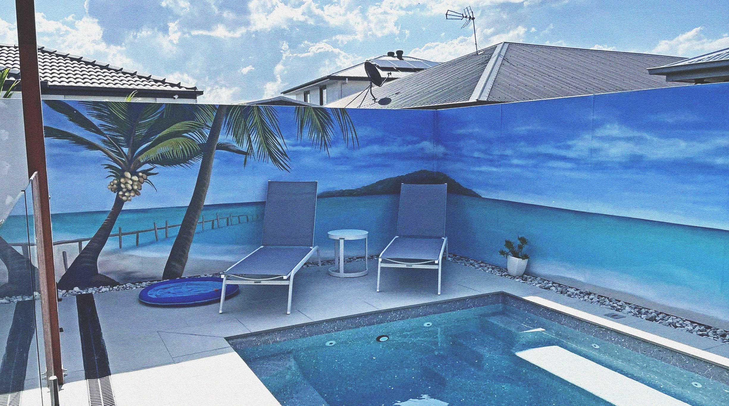 Gold Coast pool mural with a tropical beach scene painted on a backyard fence
